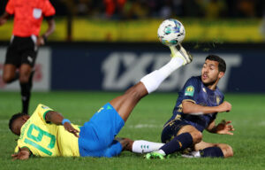 Mamelodi Sundowns midfielder Bathusi Aubaas is challenged by Houssem Tka of Esperance Tunis during their Champions League semifinals second leg at Loftus Stadium.